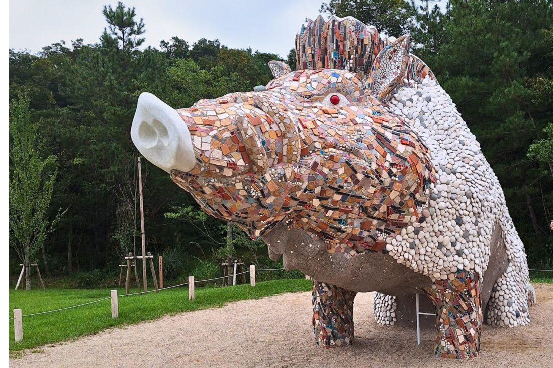 A sculpture of Naga, the boar spirit from Princess Mononoke, at Ghibli Park