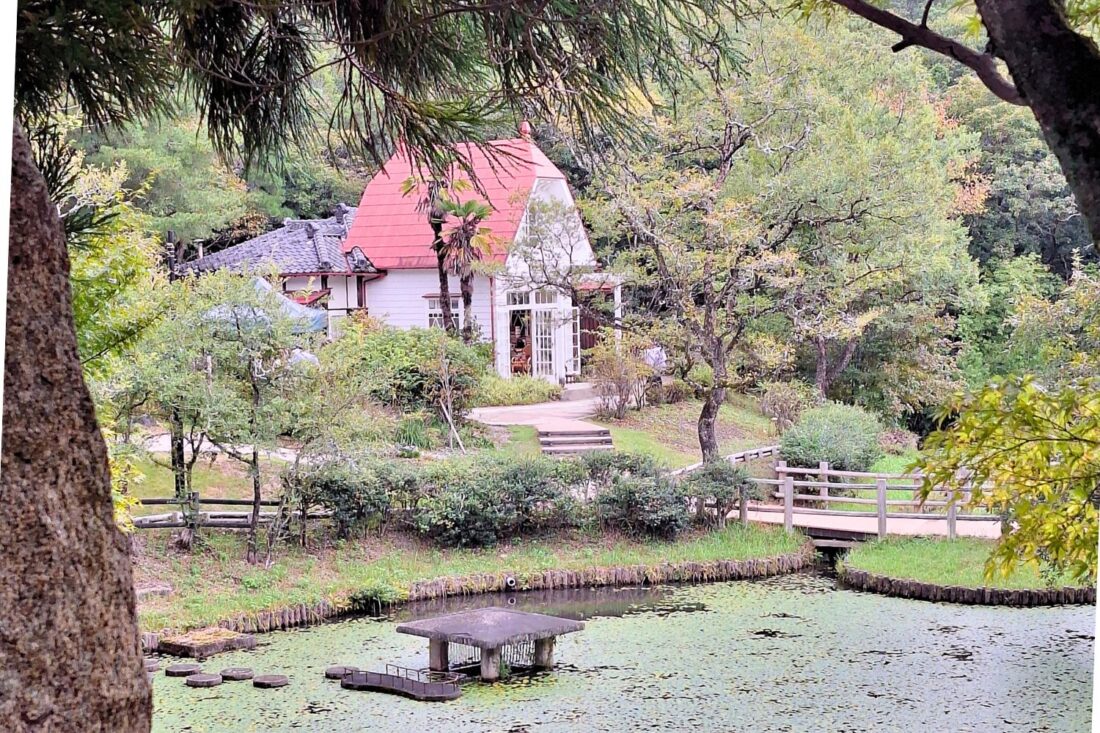 Photo of a pond and building at Ghibli Park