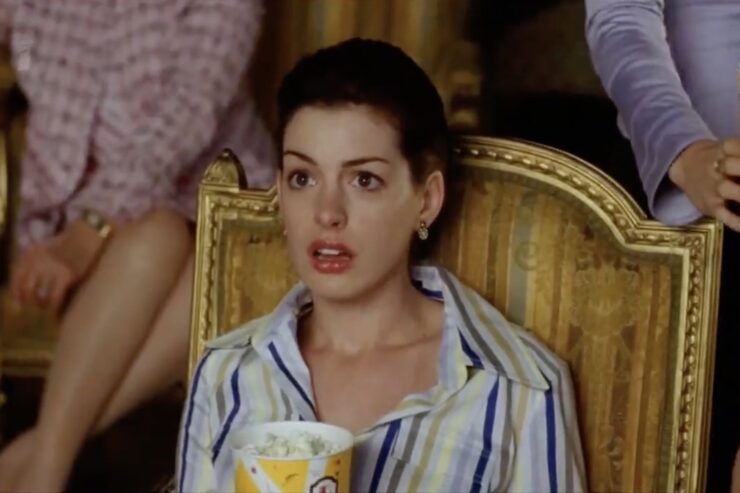 Anne Hathaway as Mia sitting in a comfy chair in PJs in Princes Diaries 2