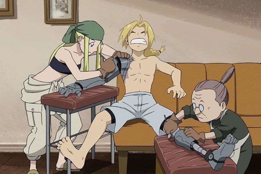 Winry and Pinako repair Ed's prosthetic limbs in a scene from Fullmetal Alchemist