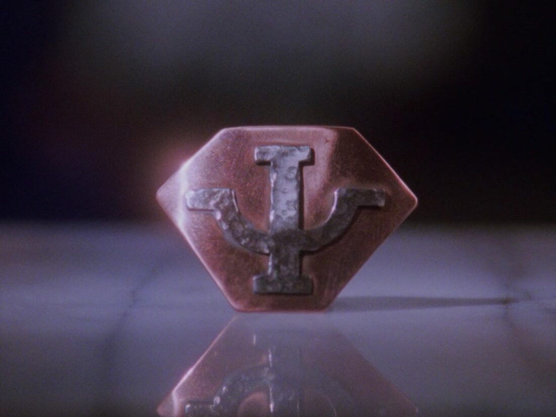 Winters' Psi Corps badge in a scene from Babylon 5 "A Race Through Dark Places"