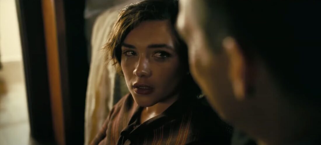 Jean Tatlock (Florence Pugh) talks with J. Robert Oppenheimer (Cillian Murphy) in Oppenheimer.