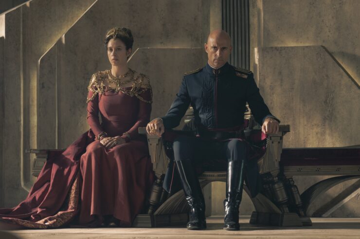 The Empress (Jodhi May) and Emperor (Mark Strong sitting uncomfortably side by side in Dune: Prophecy episode one, The Hidden Hand