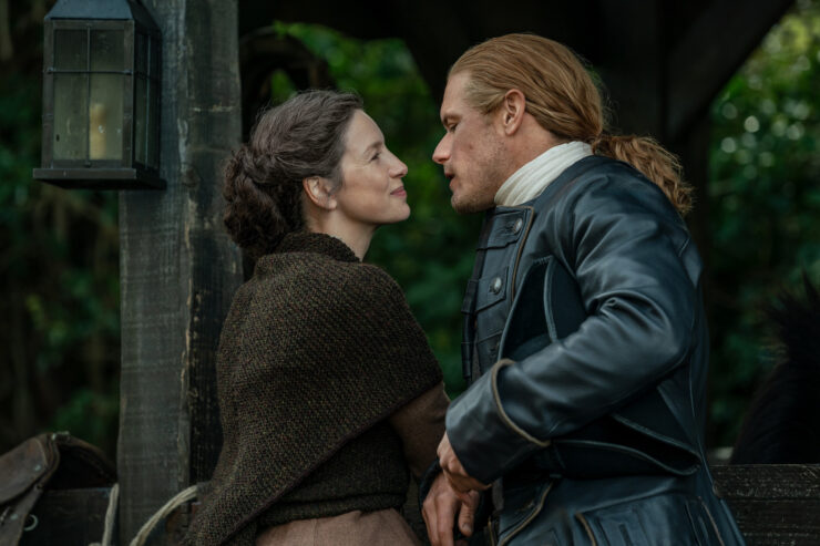 Jamie and Claire embracing in Outlander season 7.5