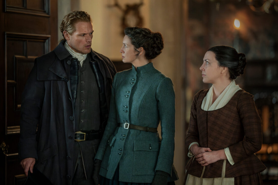 Jenny standing beside Claire and Jamie in Outlander season 7.5