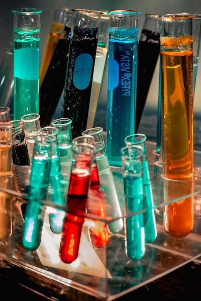 Photo of various test tubes filled with colorful liquids