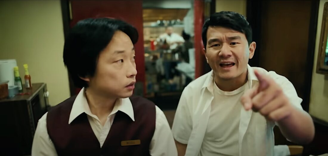 Willis Wu (Jimmy O. Yang) and Fatty Choi (Ronny Chieng) are startled by the news on Interior Chinatown.