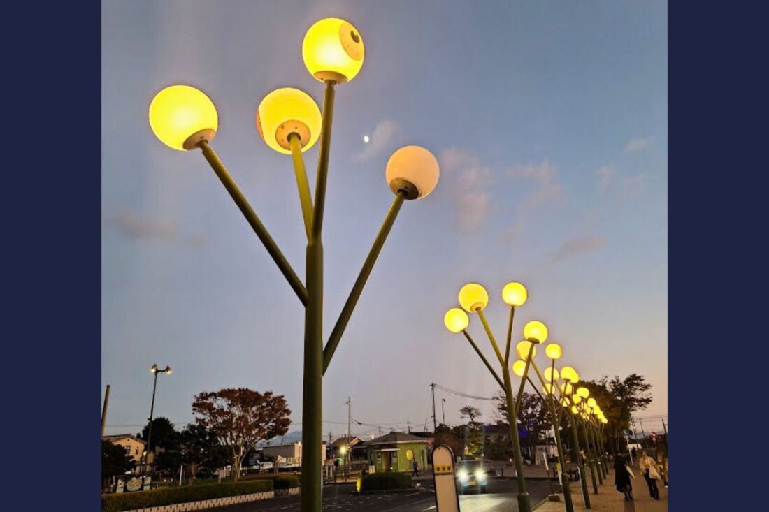 Photo of streetlights designed like eyeballs on the Mizuki Shigeru Road in Sakaiminato, Japan