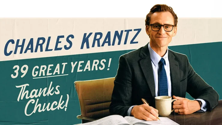 Tom Hiddleston in The Life of Chuck in front of poster that reads "Charles Krantz. 39 Great Years! Thanks, Chuck!"