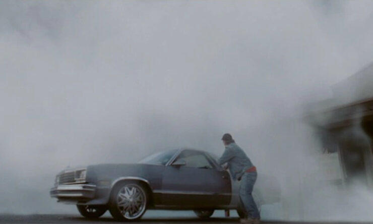 A thick mist rolls in over a man rushing to his car in a scene from Frank Darabont's The Mist (2007)