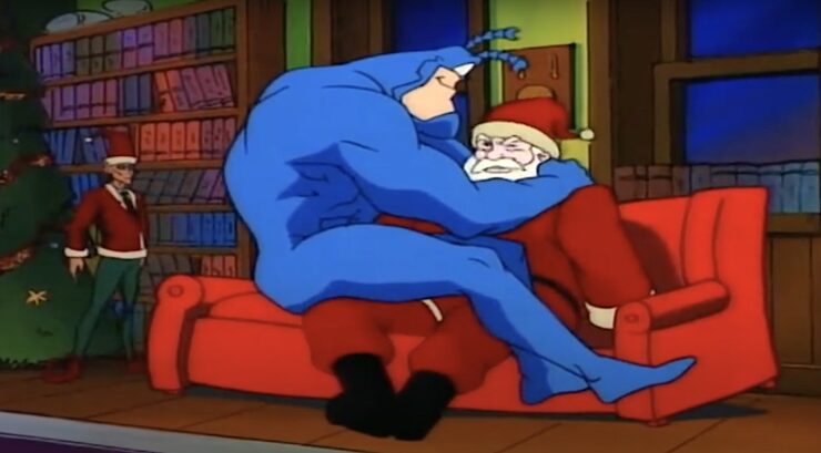 Tick sits on Santa's lap in "The Tick Loves Santa!" (1994).