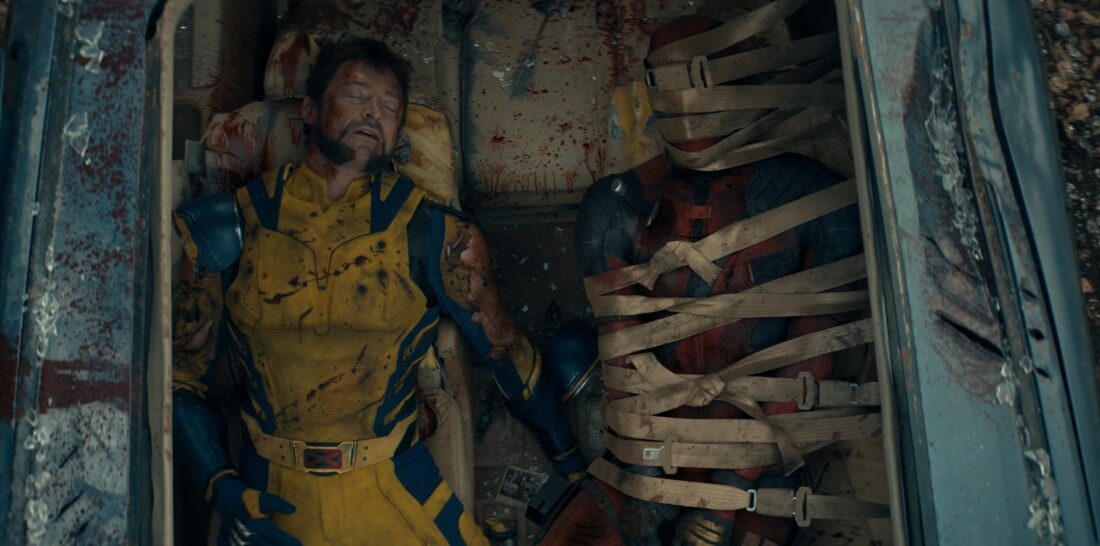 Wolverine and Deadpool share a post-fight/post-coital nap in the back of a Honda Odyssey.