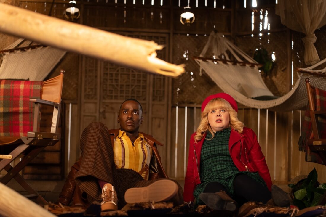 The Doctor and Joy on the floor of an observational hut in the Cretaceous Period in Doctor Who's "Joy to the World"