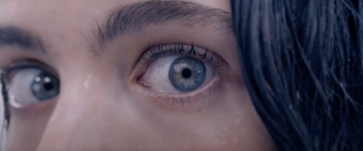 A close-up of a character's eyes appears in a behind-the-scenes featurette for The Substance.