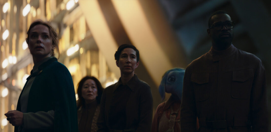 (Left) Fara (Kerry Condon), (Fourth from L-R) Neel (Robert TImothy Smith and Wendle (Tunde Adebimpe) in the Vault, looking for their kids in Star Wars: Skeleton Crew's "We're Gonna Be in So Much Trouble"