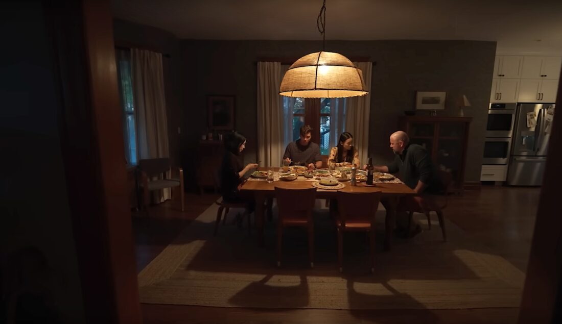 The Payne family (Lucy Liu, Eddy Maday, Callina Liang, and Chris Sullivan) tries and fails to find connection over a tense dinner in Presence.