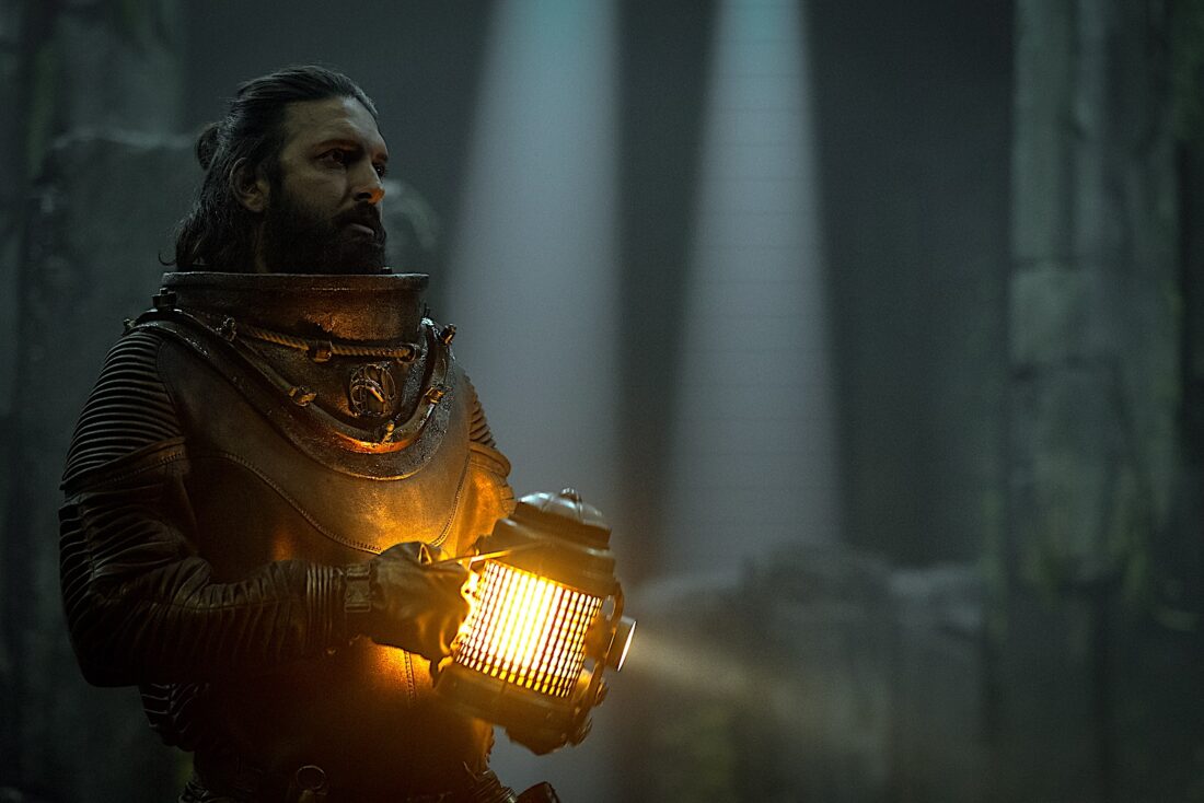 Shazad Latif exploring in the dark in Nautilus