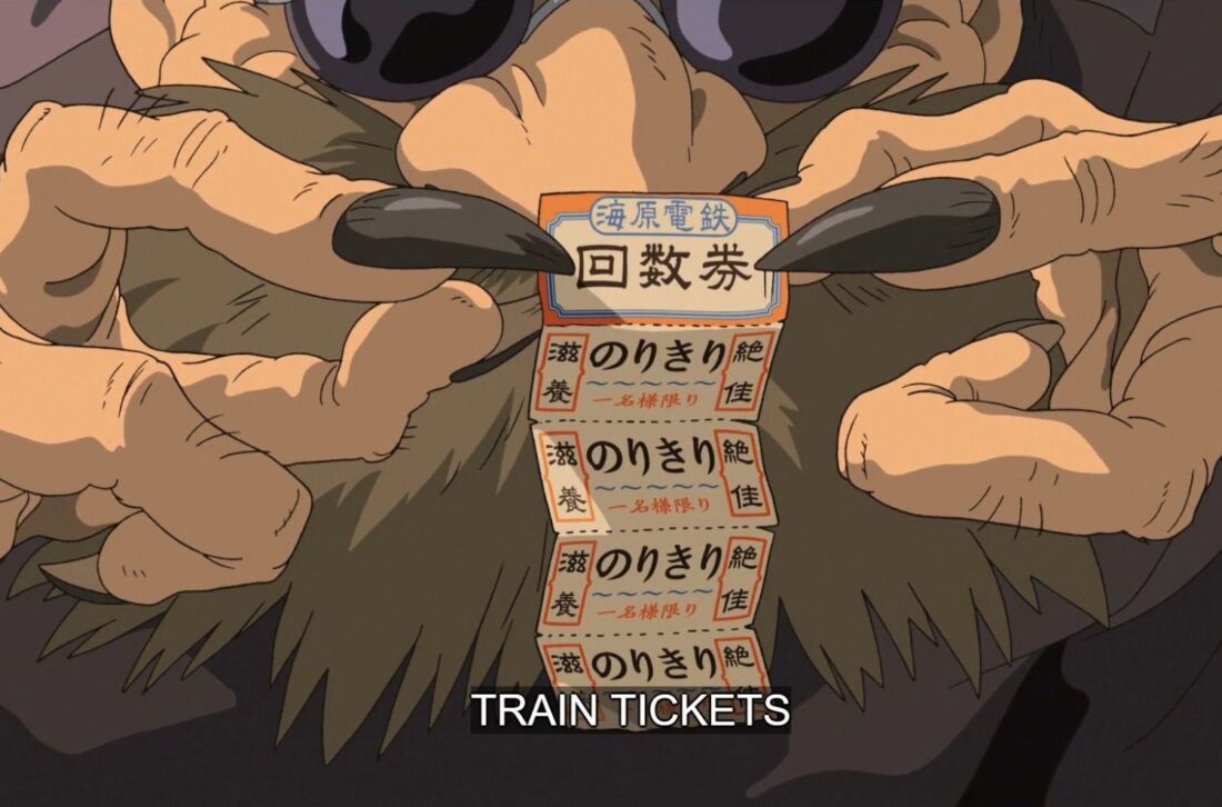 Kamaji holds train tickets in a scene from Studio Ghibli's Spirited Away