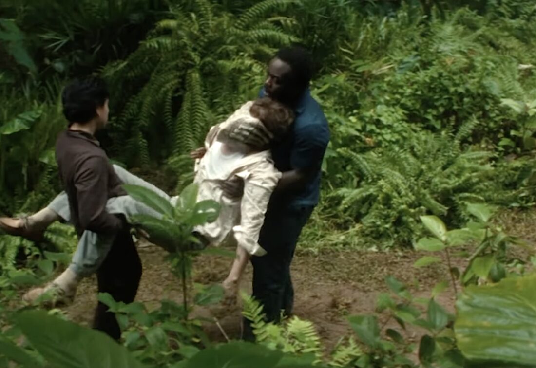 Slightly (Adarsh Gourav) and Smee (Jonathan Ajayi) carry Arthur (David Rysdahl) after he's attacked by a facehugger in Alien: Earth.
