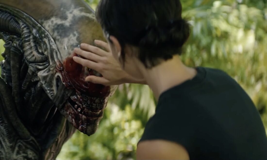 Wendy (Sydney Chandler) wipes blood off the alien's face in Noah Hawley's Alien: Earth.