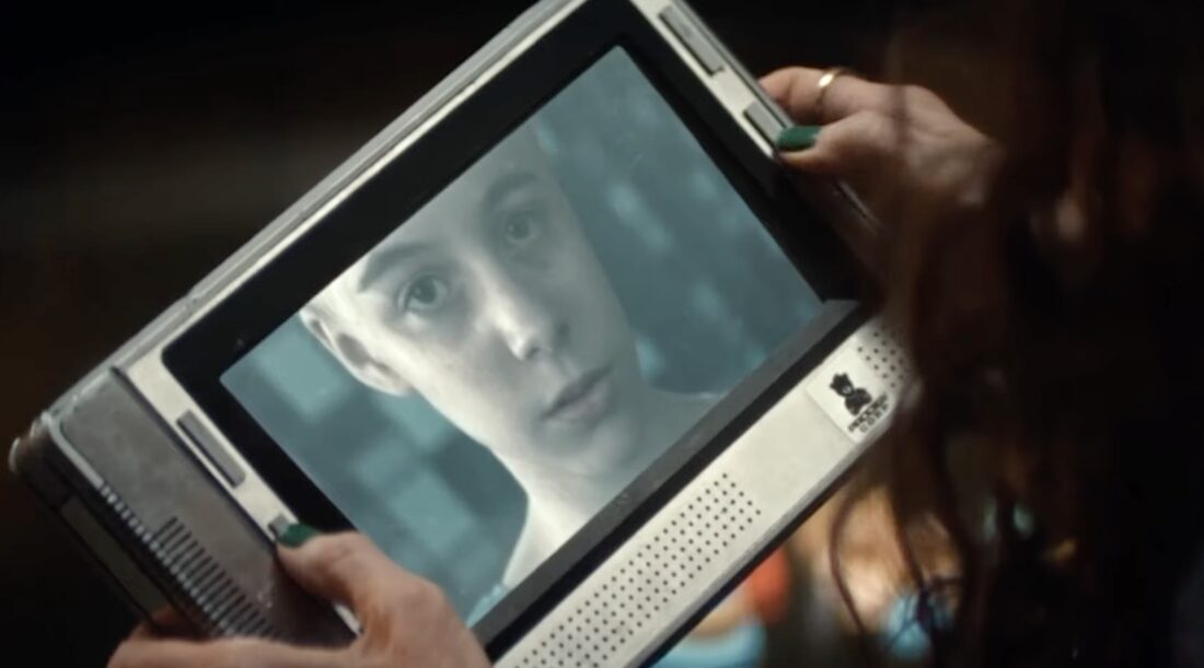 Dame Sylvia (Essie Davis) watches a video of Marcy Hermit from the Transhumanism Project in Noah Hawley's Alien: Earth.