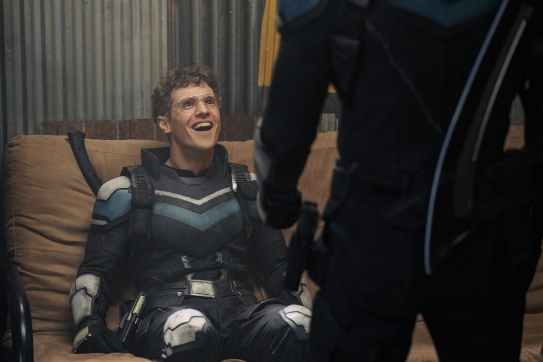 Adrian stares at his alt-dimension self joyfully in Peacemaker's "Ignorance Is Chris"