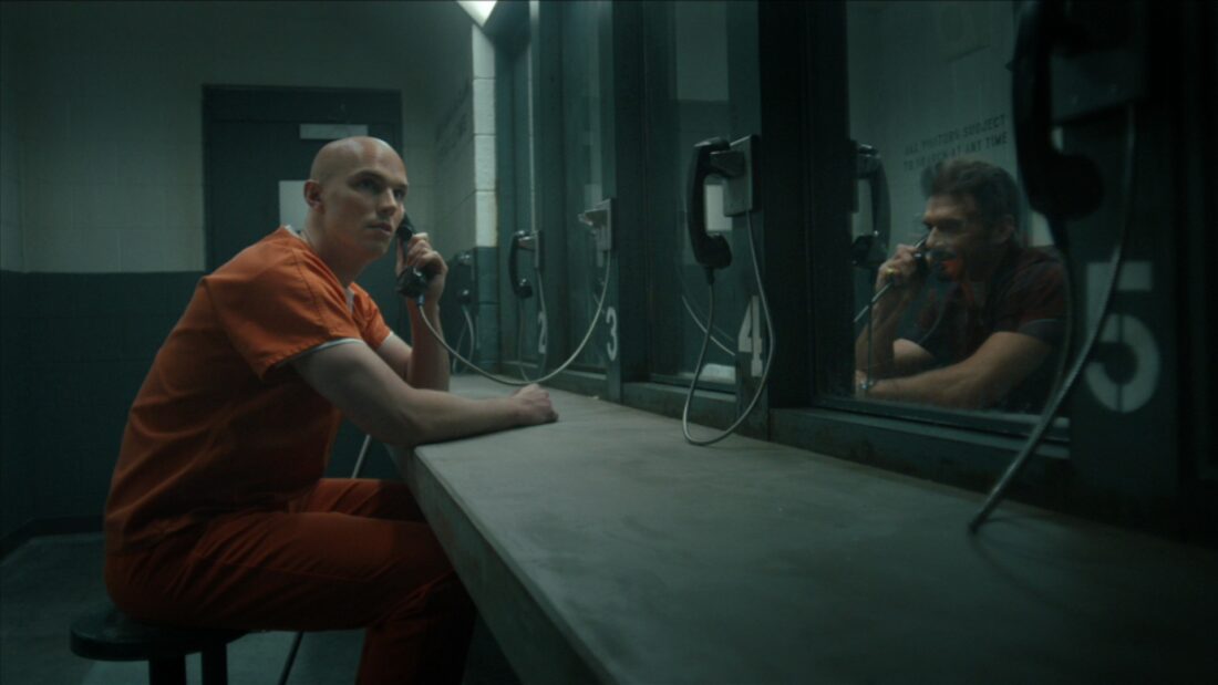 Luthor talking to Rick Flag over the phone at Belle Reve prison in Peacemaker's "Ignorance Is Chris"