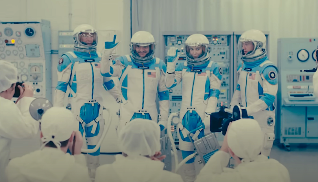 Ben Grimm, Reed Richards, Sue Storm, and Johnny Storm wearing space suits in The Fantastic Four: First Steps