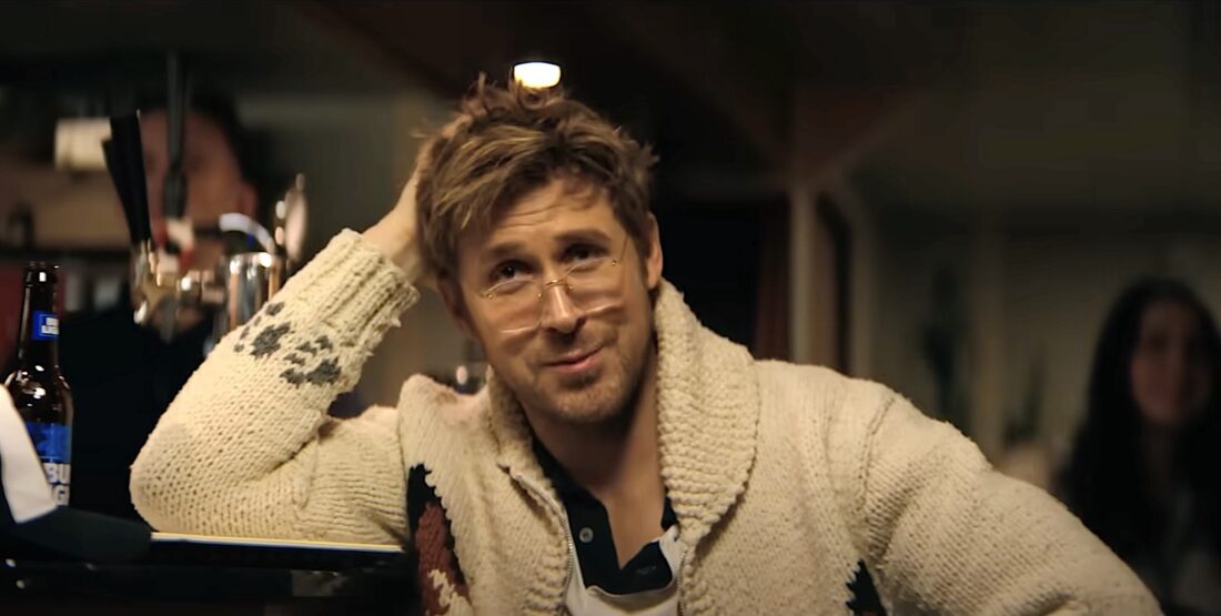 Ryland Grace (Ryan Gosling) sits alone at a bar during a karaoke party in Project Hail Mary