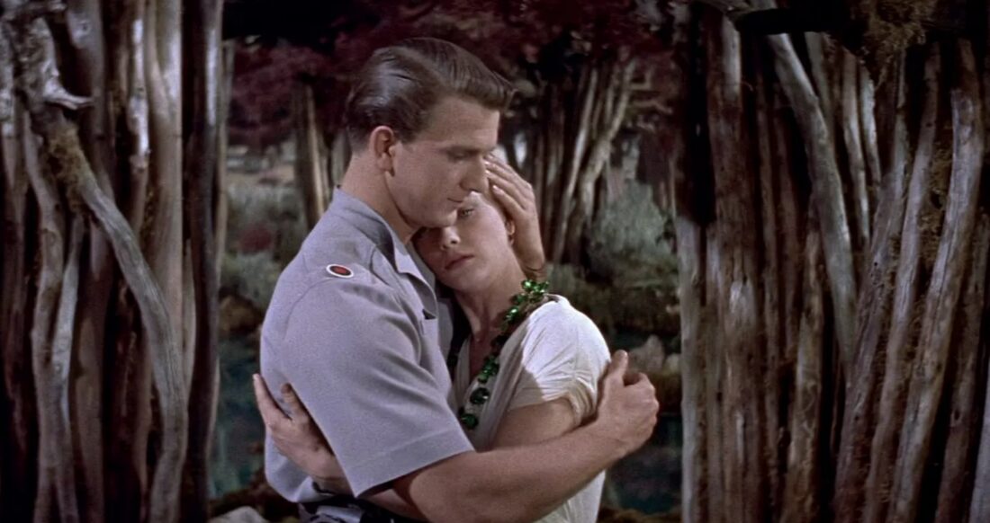 Adams and Altaira embrace in Forbidden Planet