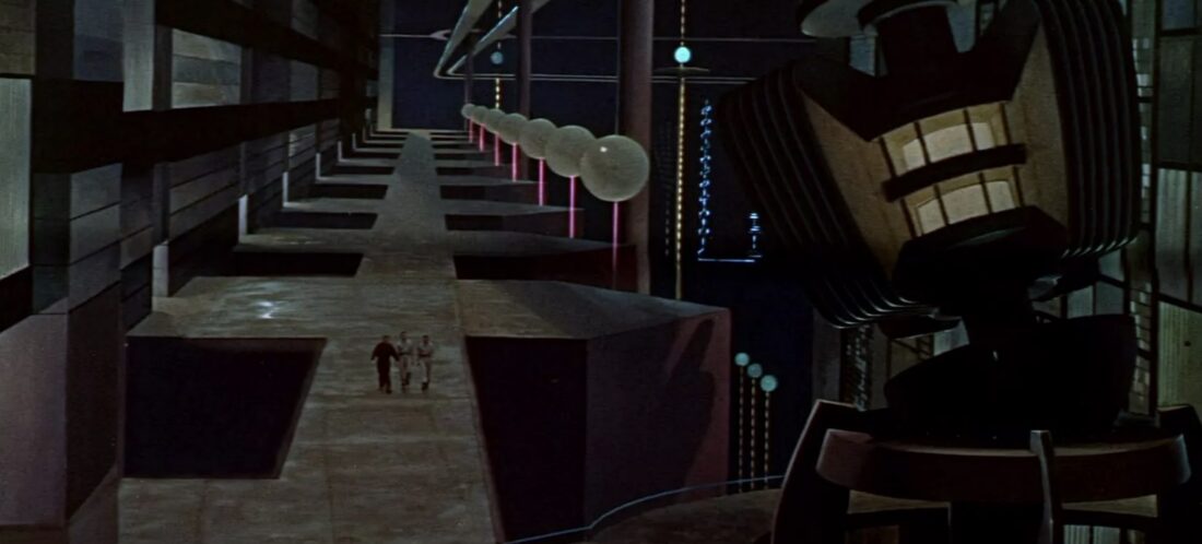 Morbius and Adams walking through a vast underground landscape constructed by long-dead aliens in Forbidden Planet