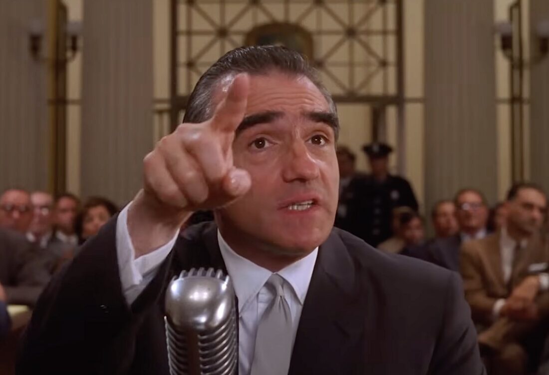 Martin Rittenhome (Martin Scorsese) gesticulates wildly during a Congressional hearing in Quiz Show.