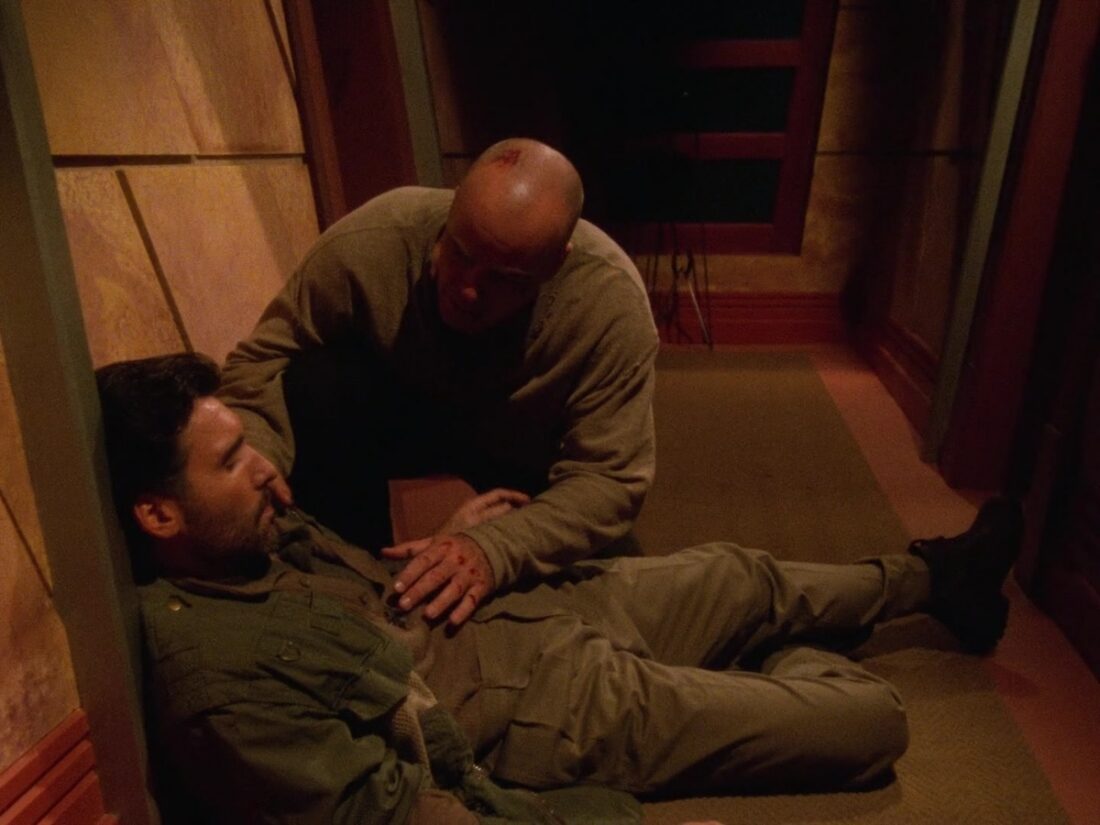 Garibaldi looks over Azir in Babylon 5 "The Ragged Edge"