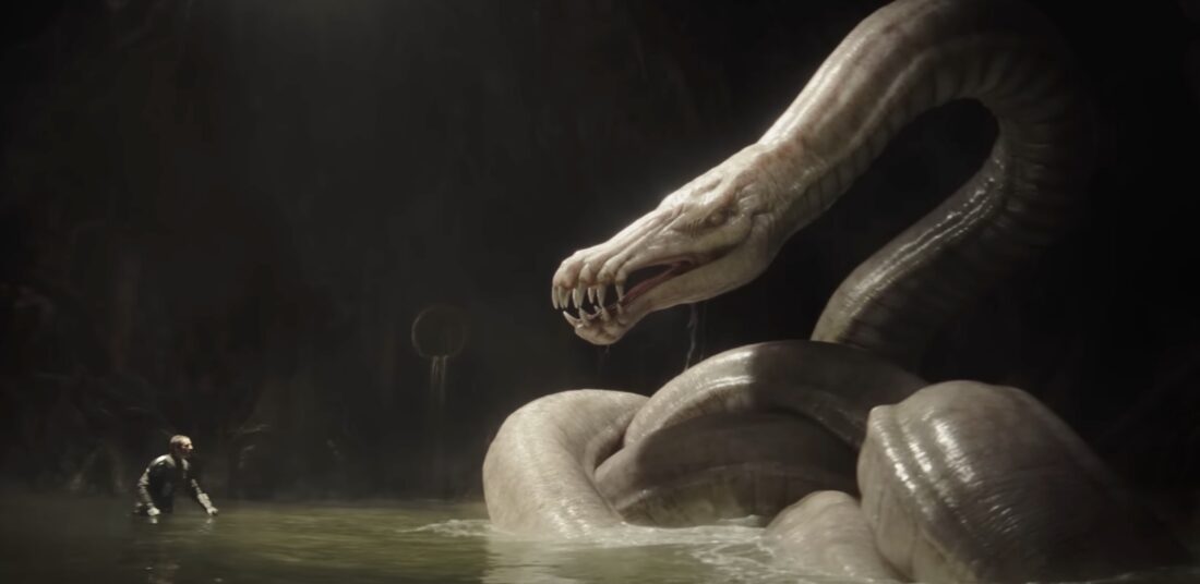 Din facing off against a sea serpent in The Mandalorian and Grogu