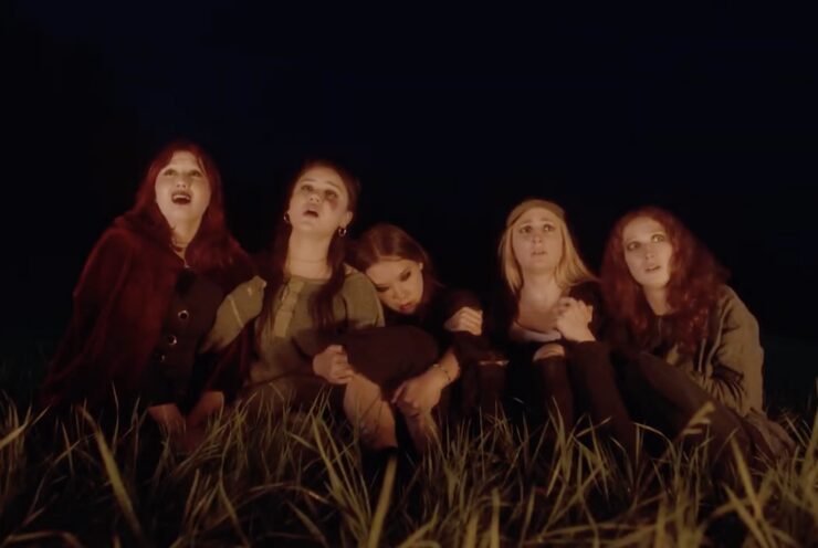 Clara (Alice Wordsworth), Rosie (Cherry Moore), Emily (Zola Grimmer), Nev (Lea Rose Sebastianis), and Hope (Ella Reece) witness a magical event in Avalon Fast's Camp.