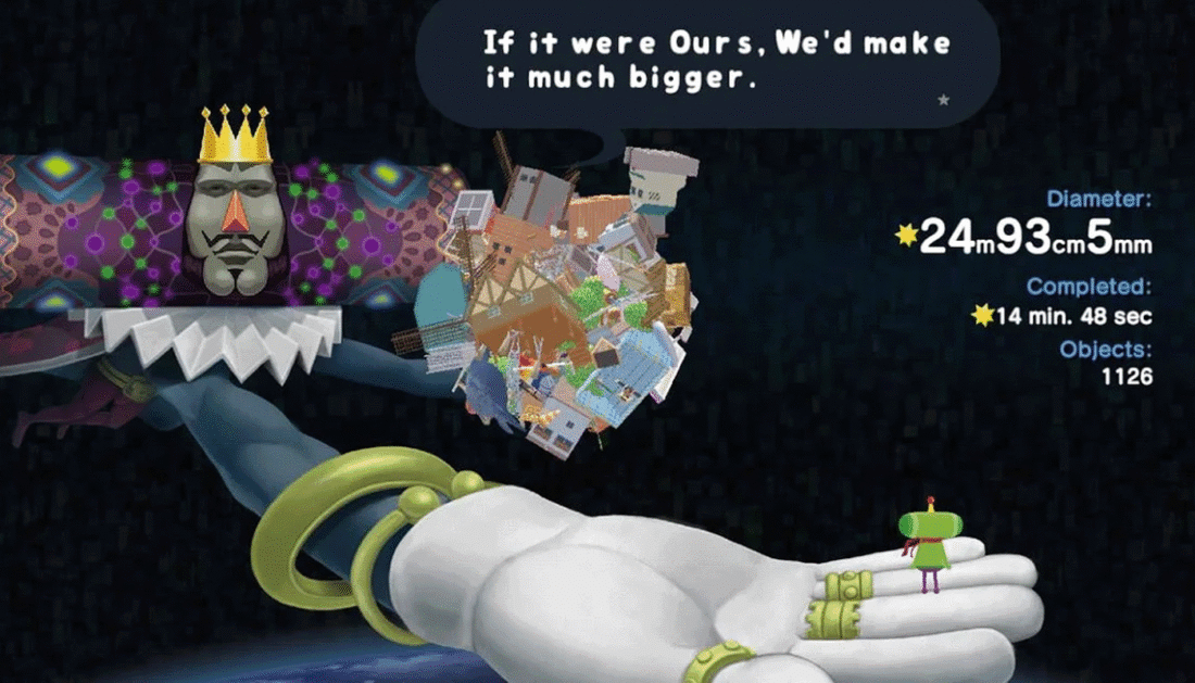 Screenshot from the video game Katamari Damacy Reroll: The King of All Cosmos holds the Prince in one hand and a completed katamari in the other; a speech bubble from the King reads "If it were Ours, We'd make it much bigger."