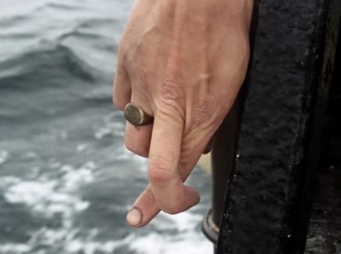 A fisherman crosses his fingers for luck in Mark Jenkin's Rose of Nevada.