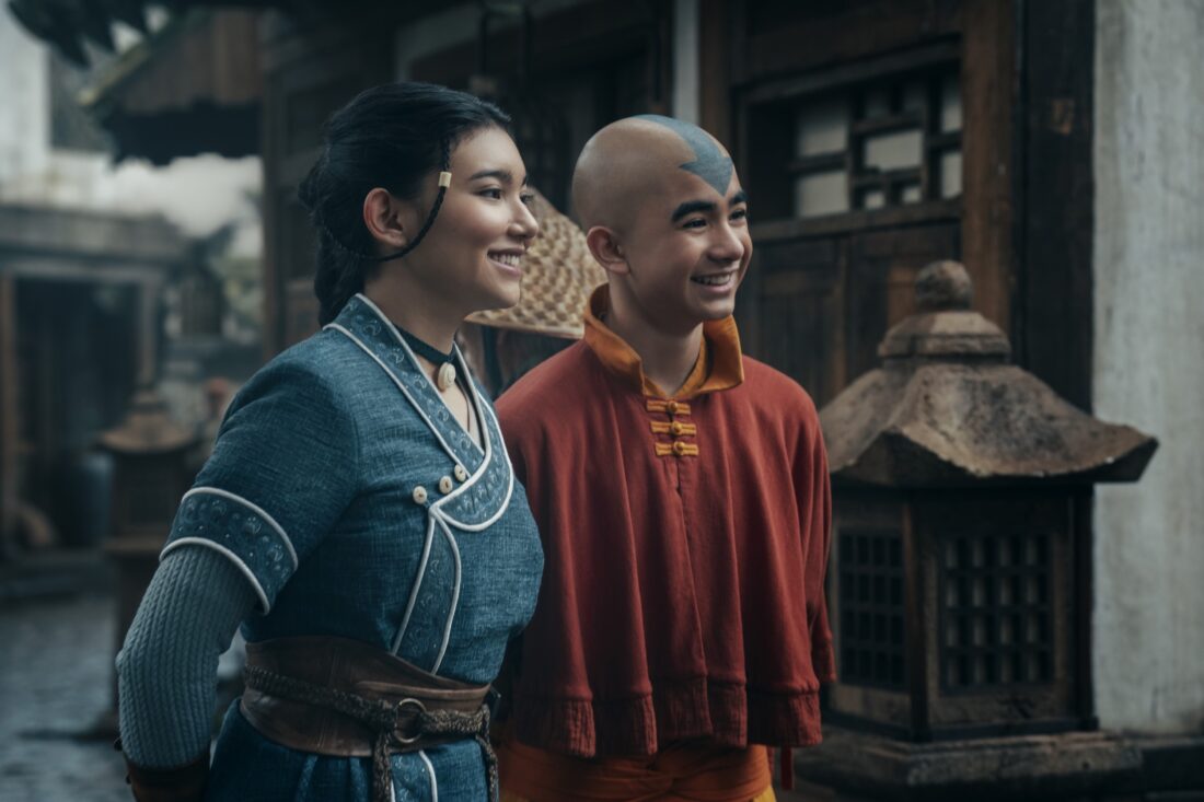 Avatar: The Last Airbender. (L to R) Kiawentiio Tarbell as Katara, Gordon Cormier as Aang in season 2 of Avatar: The Last Airbender, both smiling side by side