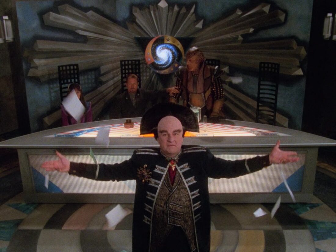 Mollari tosses papers into the air before the Interstellar Alliance. Image from Babylon 5 “And All My Dreams, Torn Asunder”