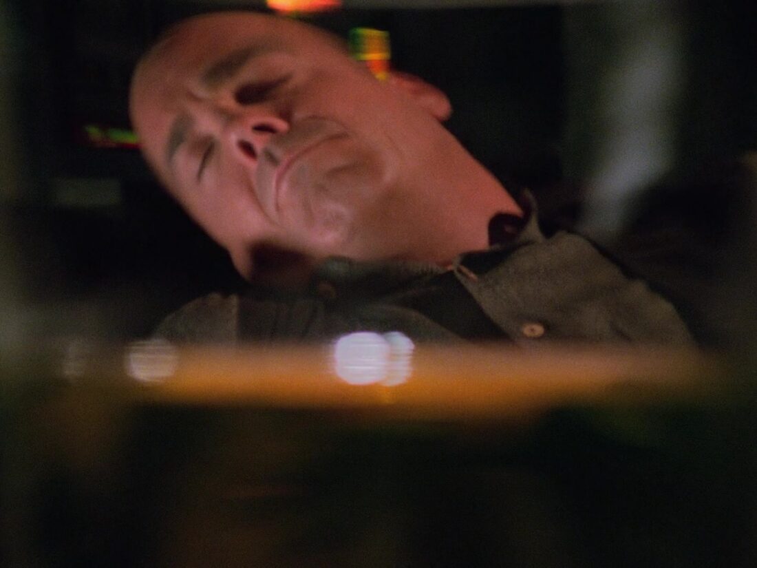 Garibaldi is seen passed out with a glass of alcohol. Image from Babylon 5 “And All My Dreams, Torn Asunder”