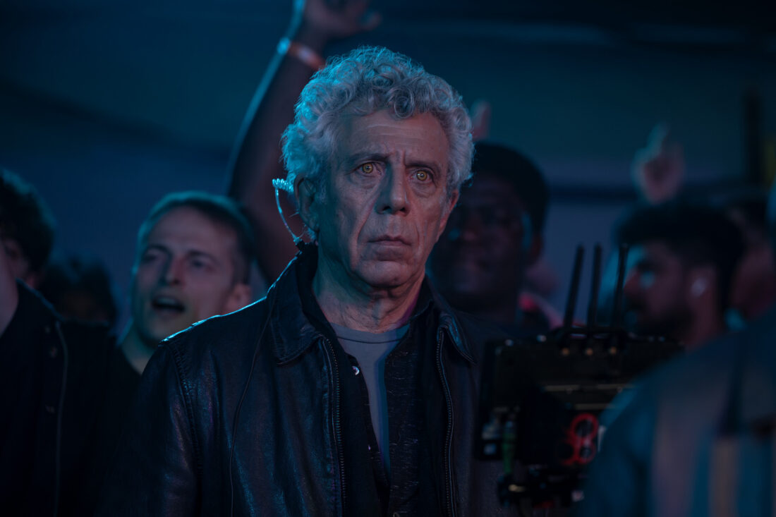 Eric Bogosian as Daniel Molloy at the concert, watching Armand in The Vampire Lestate episode 4