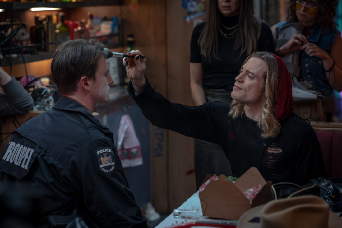 Sam Reid as Lestat De Lioncourt and Jesse LaVercombe as Police Officer Gillogly the former painting the latter's face with cocaine in The Vampire Lestat episode 4