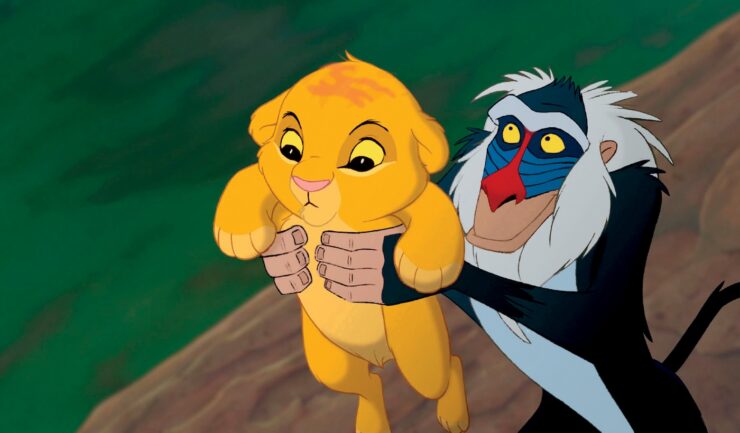 A still from the animated film The Lion King: Rafiki (a mandrill) raises Simba (a lion cub) above Pride Rock