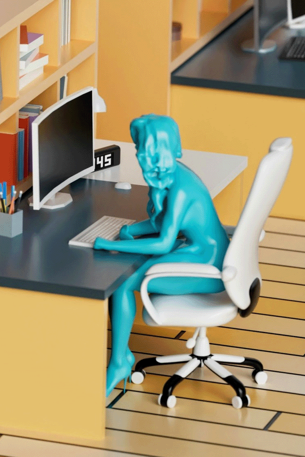 Photo of a model office with a worker seated at a desk