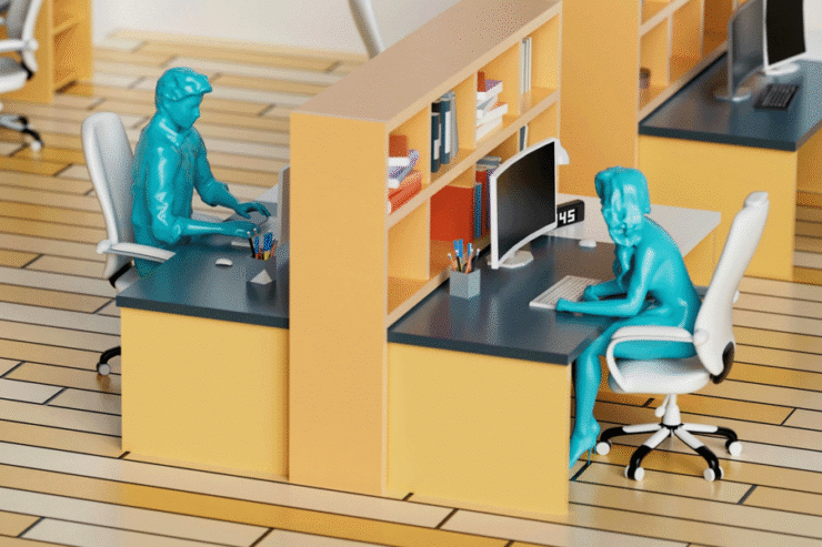 Photo of a model office with several workstations and model workers