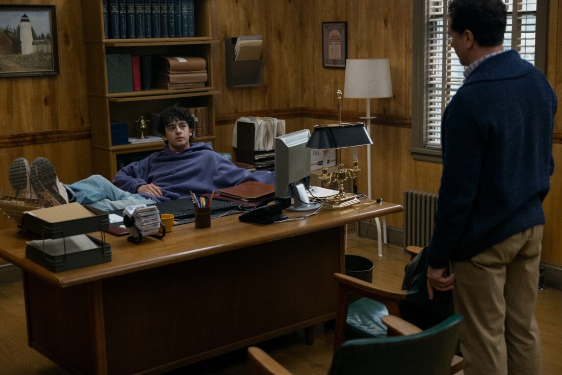 Tom's son at his desk (which has a Rolodex on it!) in Widow's Bay