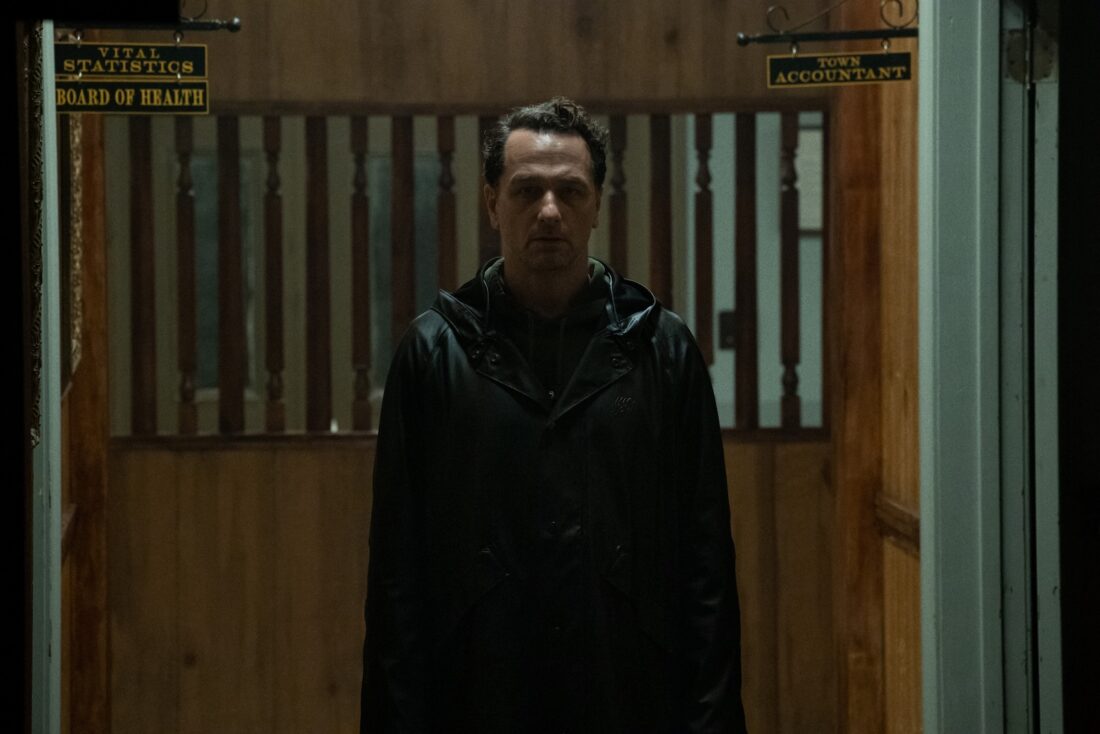 Tom Loftus in the office building looking like he's on a cursed island in Widow's Bay