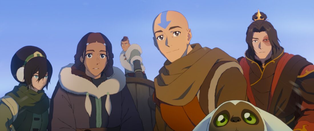 (L-R): Dionne Quan voices Toph, Jessica Matten voices Katara, Román Zaragoza voices Sokka, Eric Nam voices Aang, Dee Bradley Baker voices Momo, and Steven Yeun voices Zuko all looking at Tagah in Avatar Aang: The Last Airbender