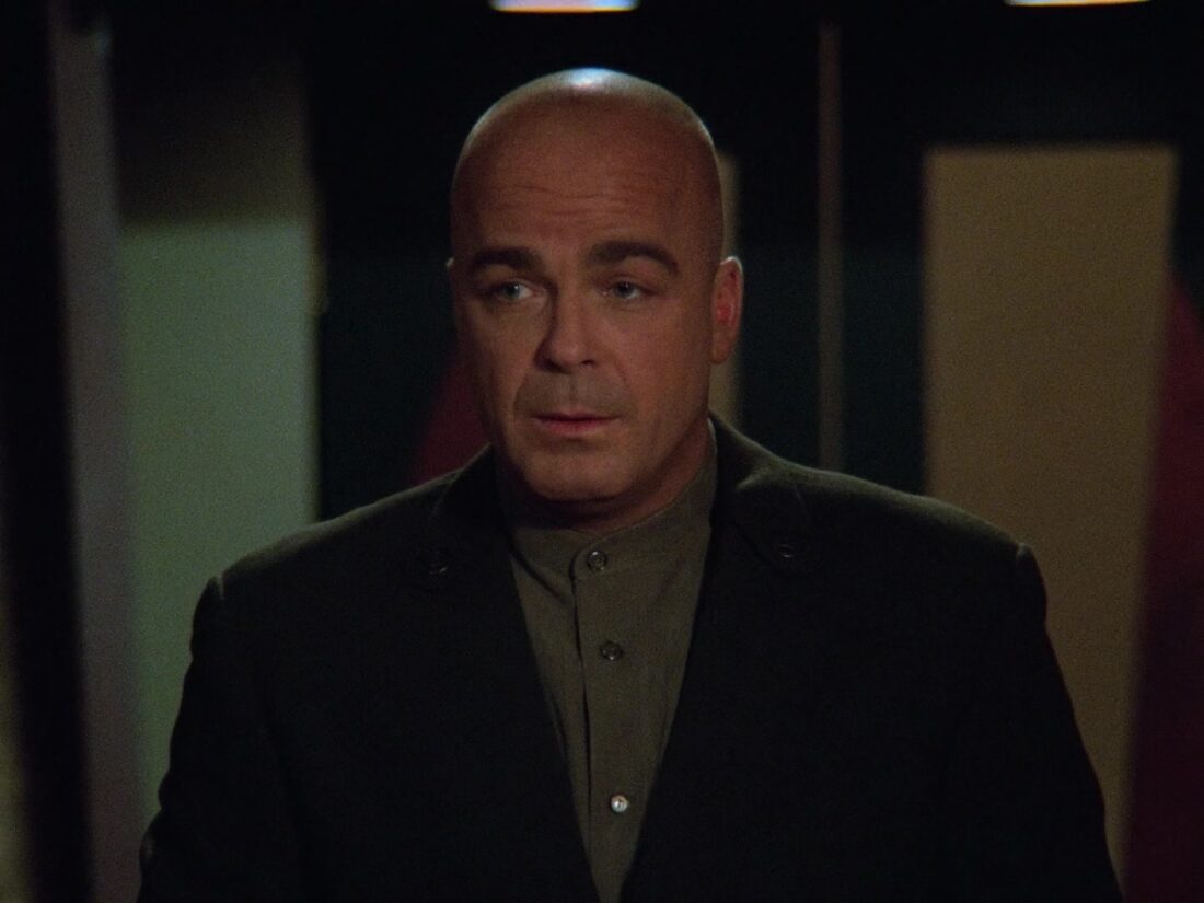 Screenshot from Babylon 5 "Objects at Rest": Garibaldi speaks to several Edgars Industries employees