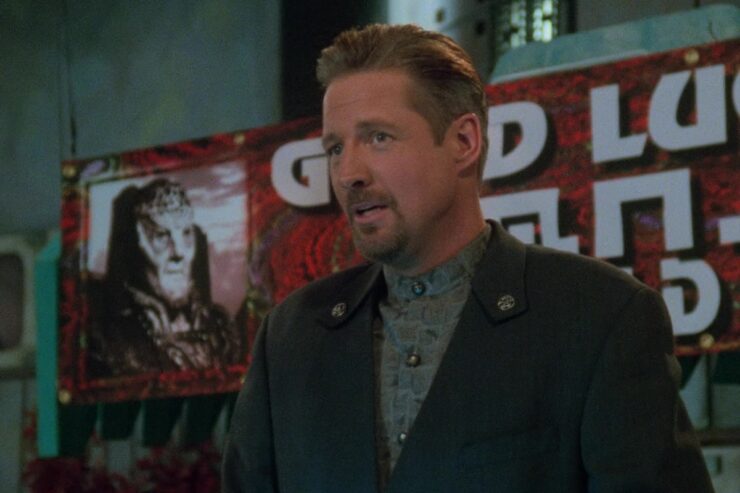 Screenshot from Babylon 5 "Objects in Motion": Sheridan makes a speech at Garibaldi and G'Kar's farewell party